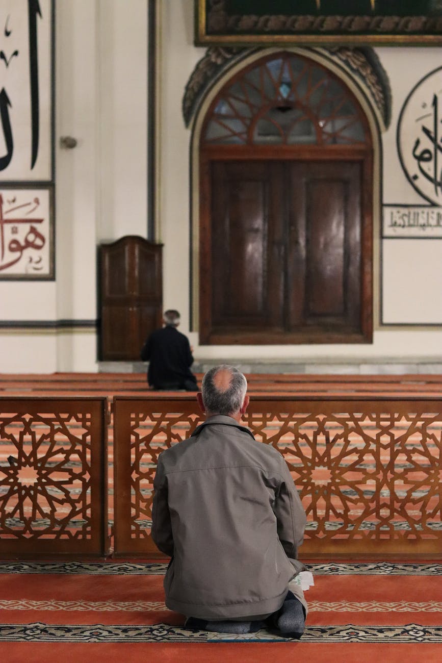 calm men praying in mosque